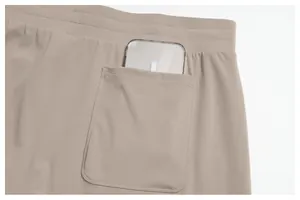 Detail view of men's athletic shorts back pocket showing spacious storage capacity