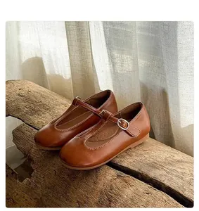 Classic brown children's T-strap Mary Jane shoes with retro leather finish.
