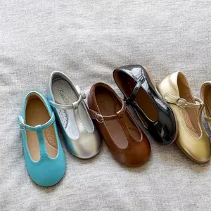 Retro T-strap Mary Jane leather shoes for girls in multiple colors on grey fabric