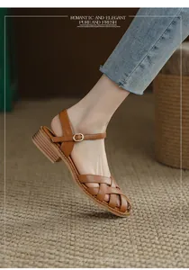 Close-up of brown French retro woven sandals with hollow out design and block heels