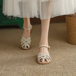 Elegant French retro white woven hollow leather sandals for women with closed toe design