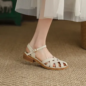 Elegant French retro woven leather sandals with hollow closed-toe design and low block heel