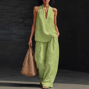 Casual light green two-piece linen set with V-neck halter top and wide-leg trousers