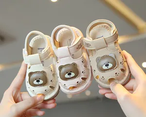 Detail view of three colors of cute toddler cartoon bear closed-toe walking sandals.