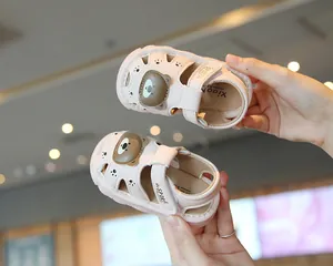 Cute pink baby cartoon sandals with bear design and soft non-slip sole for toddlers