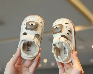 Closed-toe baby sandals with cute cartoon bear design and soft anti-slip soles