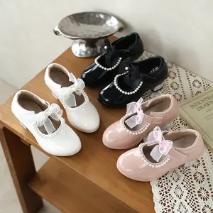 Elegant girls' pearl Mary Jane shoes with bows in white, black, and pink colors