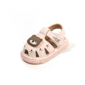 Cute pink baby sandals with cartoon bear design and soft non-slip sole for toddlers walking