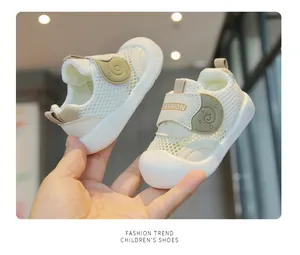 Close-up view of breathable mesh baby walking shoes with soft white non-slip sole