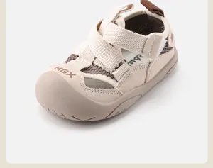 Detailed close-up view of beige toddler closed-toe beach sandals with mesh upper