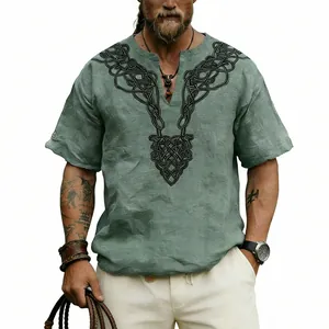 Close-up detail of the vintage black Celtic knot print on a green slub linen V-neck shirt