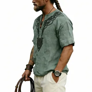 Detailed view of green slub linen shirt featuring a black Celtic knot V-shaped print
