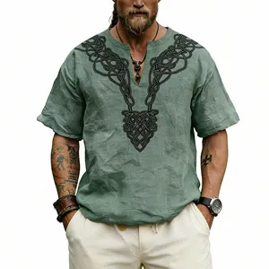 Detailed view of the black Celtic knot print on a sage green linen-textured V-neck T-shirt.