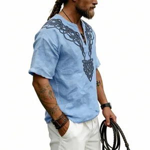 Side view detail of a light blue vintage t-shirt featuring a black Celtic knot V-print