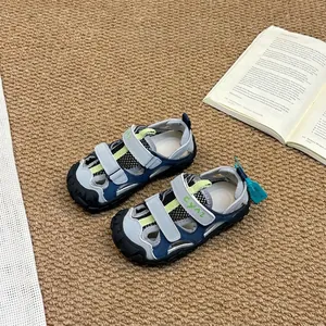 Detailed view of breathable blue and grey children's outdoor closed-toe sports sandals