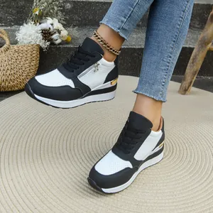 Vista dettagliata delle sneakers platform da donna in bianco e nero stringate