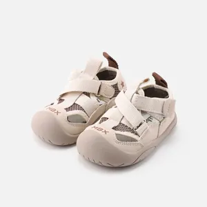 Breathable beige toddler closed-toe sports sandals with mesh and secure cross straps