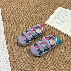 Durable grey children's closed-toe sports sandals with pink mesh and non-slip soft soles