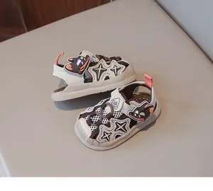 Detail of breathable cartoon toddler sandals with luminous sole and velcro strap