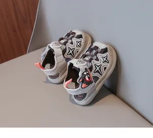 Close-up view of glowing closed-toe toddler sandals with cartoon cat and mesh detail
