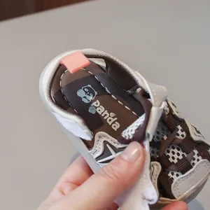 Close-up of breathable luminous toddler sandals with cute panda print on the insole