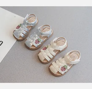 Close-up detail of toddler girls closed-toe sandals with cute strawberry embroidery