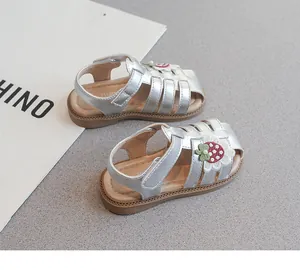 Silver closed-toe girls sandals with cute strawberry embroidery and soft anti-slip soles.