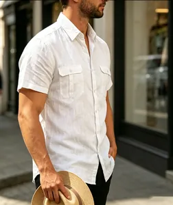 Detail view of a men's casual white short sleeve shirt featuring dual chest pockets