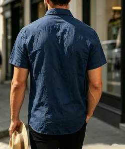 Back view of navy blue men's jacquard short sleeve shirt showing fabric texture.