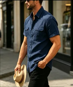 Detailed side view of navy blue short sleeve linen shirt with chest pockets