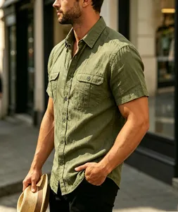 Detailed view of men's olive green linen short-sleeved shirt with chest pockets