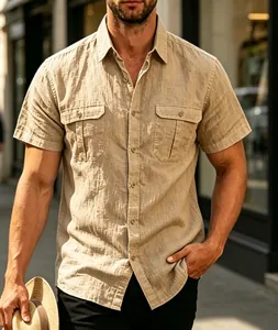 Close-up of a men's khaki linen-textured short-sleeve shirt with dual chest pockets