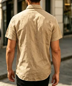 Back view of men's beige linen short sleeve casual shirt in outdoor street setting