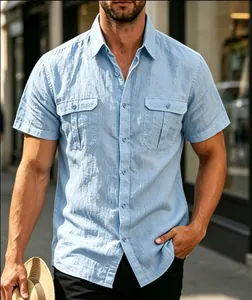 Men's light blue short-sleeve jacquard button-down shirt with double chest pockets.