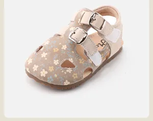 Close-up of toddler girls floral hollow sandals with dual silver buckle straps