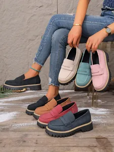 Close-up view of vintage matte loafers in multiple colors with chunky platform soles.