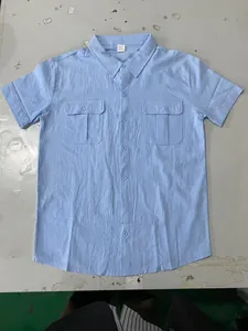 Light blue men's short-sleeve linen-blend shirt featuring classic collar and chest pockets