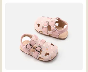 Detailed view of pink floral toddler girl sandals with hollow-out design and soft sole.