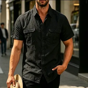Casual men's black short-sleeved shirt with textured jacquard fabric and two chest pockets.