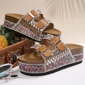 Detail of rhinestone platform slides with double buckles and colorful bead accents