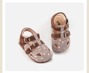Detailed top view of toddler girls floral sandals with brown suede straps and buckles