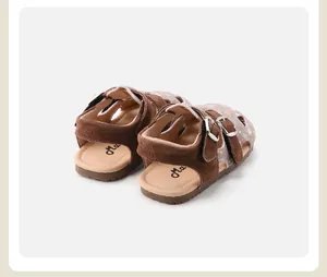 Rear view of floral hollow-out baby girl sandals with brown suede straps