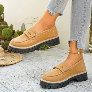 Retro khaki chunky platform loafers with round toe and penny strap detail for women