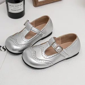 Elegant silver metallic Mary Jane shoes for girls with brogue perforation details