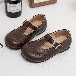Classic brown girls T-strap Mary Jane leather shoes with elegant brogue wingtip details