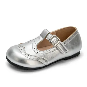 Elegant silver metallic girl's Mary Jane princess shoes with brogue perforations and buckle.