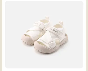 Detailed view of white breathable kids sports sandals with protective closed toe