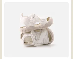 Side view of white children's sports sandals with soft sole and bump-proof closed toe.