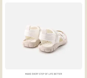 Detailed rear view of white children's closed-toe sandals with soft chunky non-slip soles