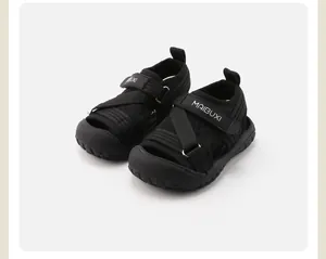 Black children's closed-toe athletic sandals with soft soles and velcro straps